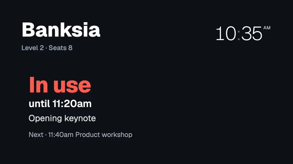 A meeting room board: Banksia, In use until 11:20am, Opening keynote, next a product workshop