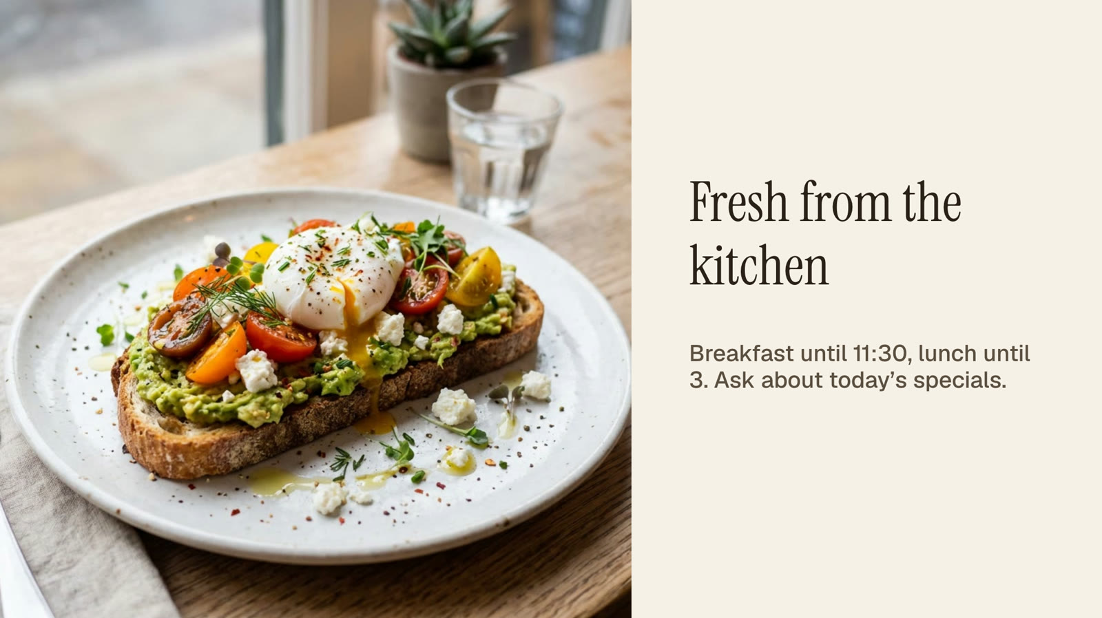 A sign with a photo slideshow of breakfast dishes and the words Fresh from the kitchen