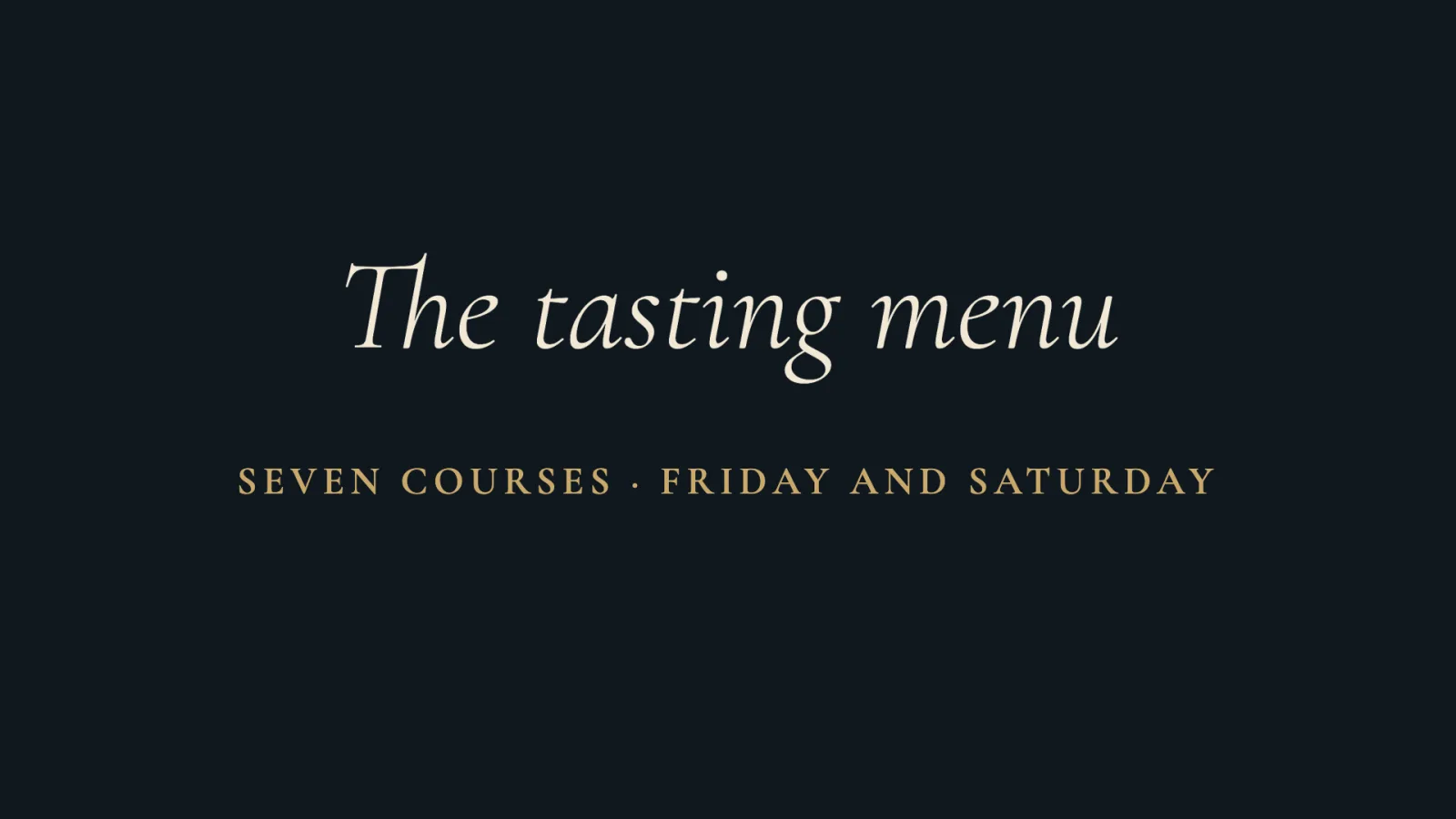 A tasting menu sign in a fine italic serif