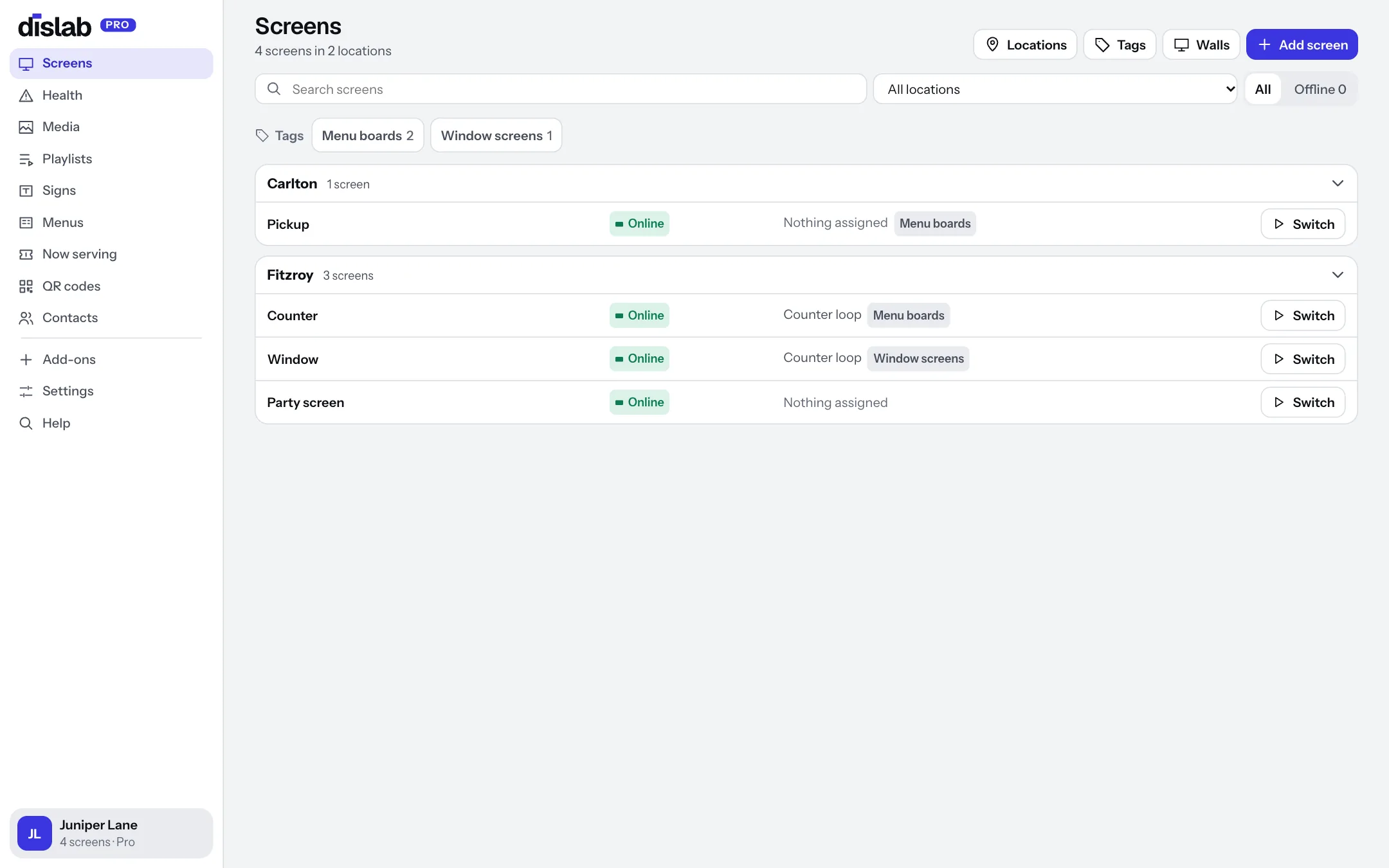 The Screens page: screens grouped by location, each online or offline, with what it plays and its tags